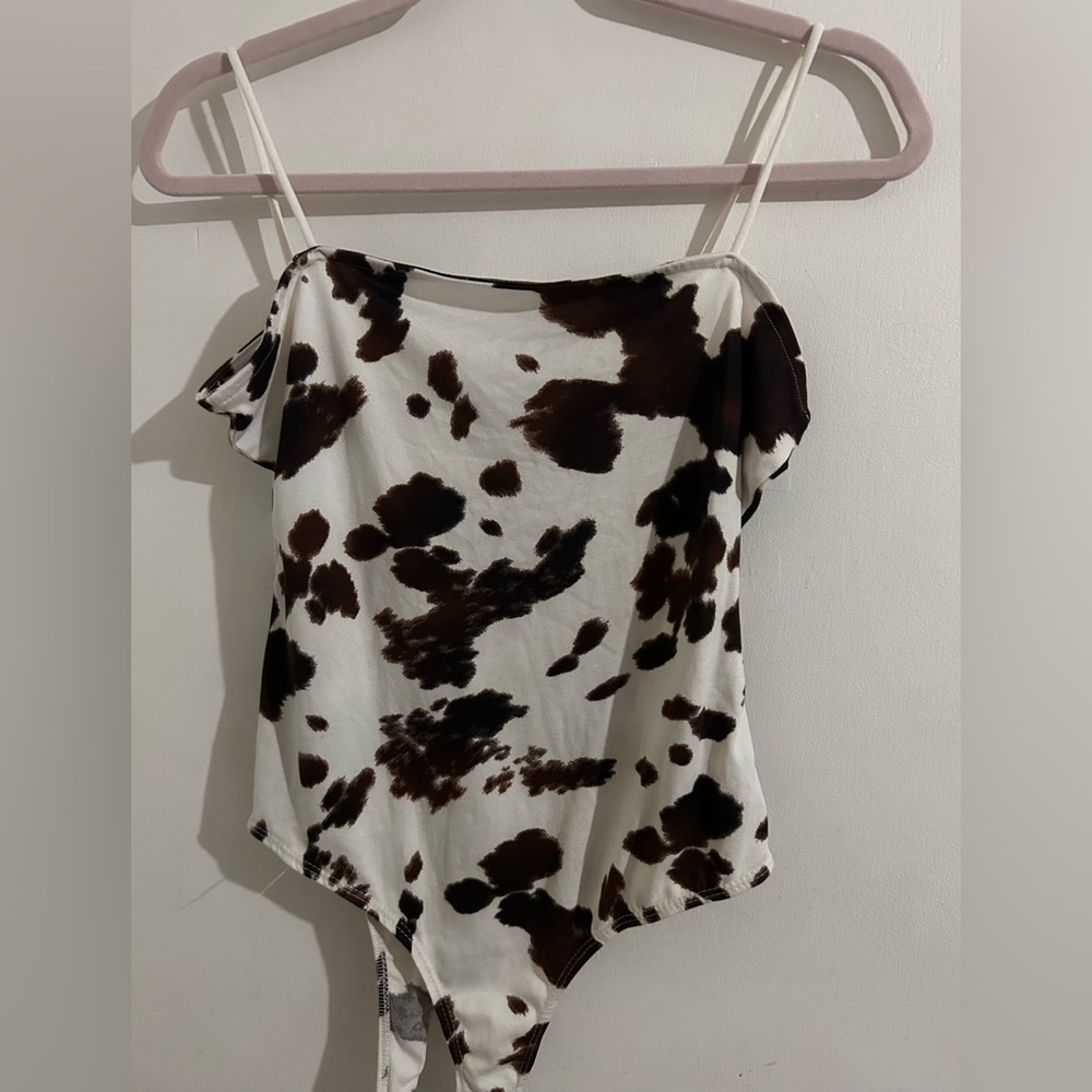 Brown and white cow print body suit